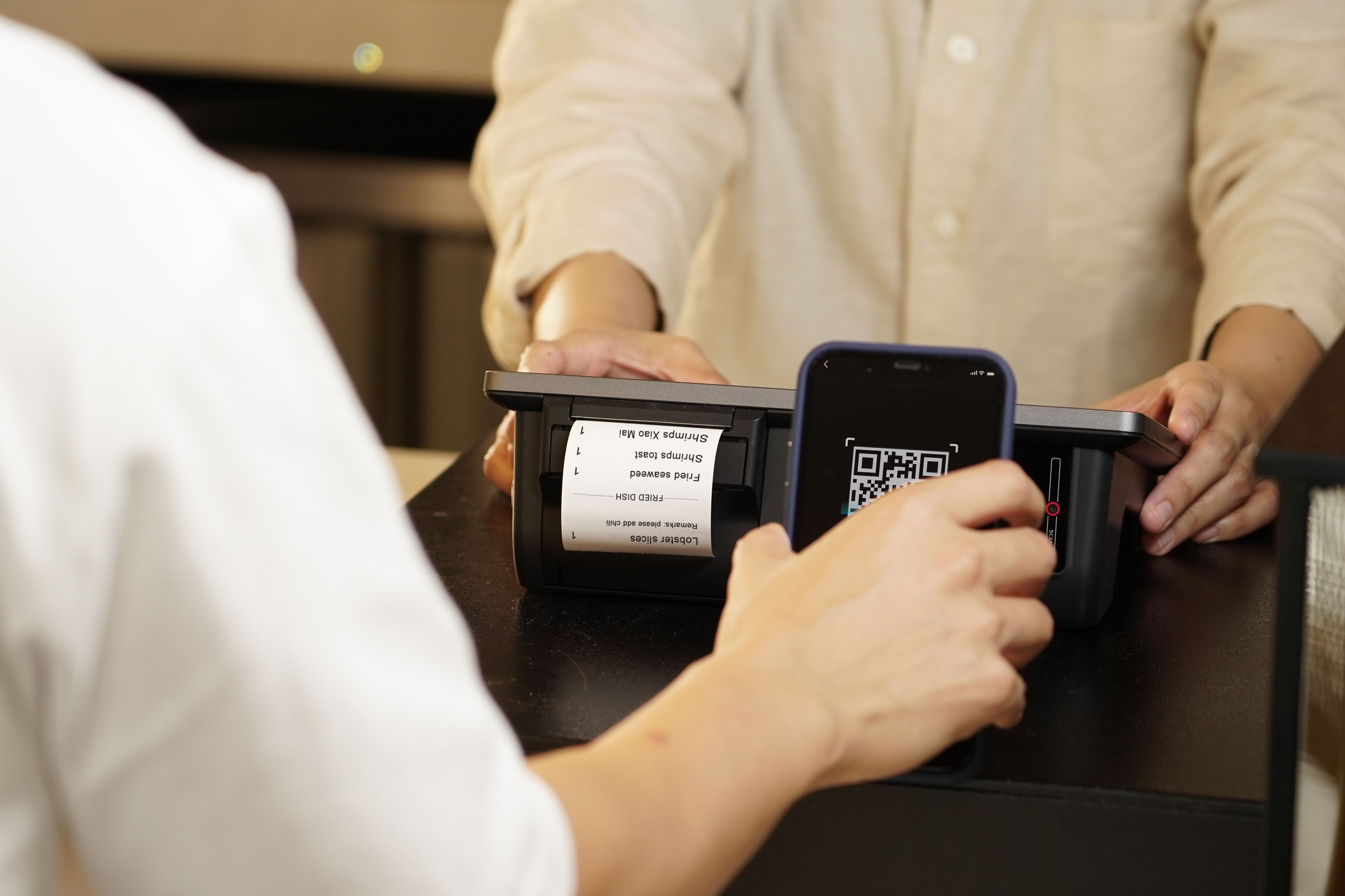 Contactless QR payment at a retail counter