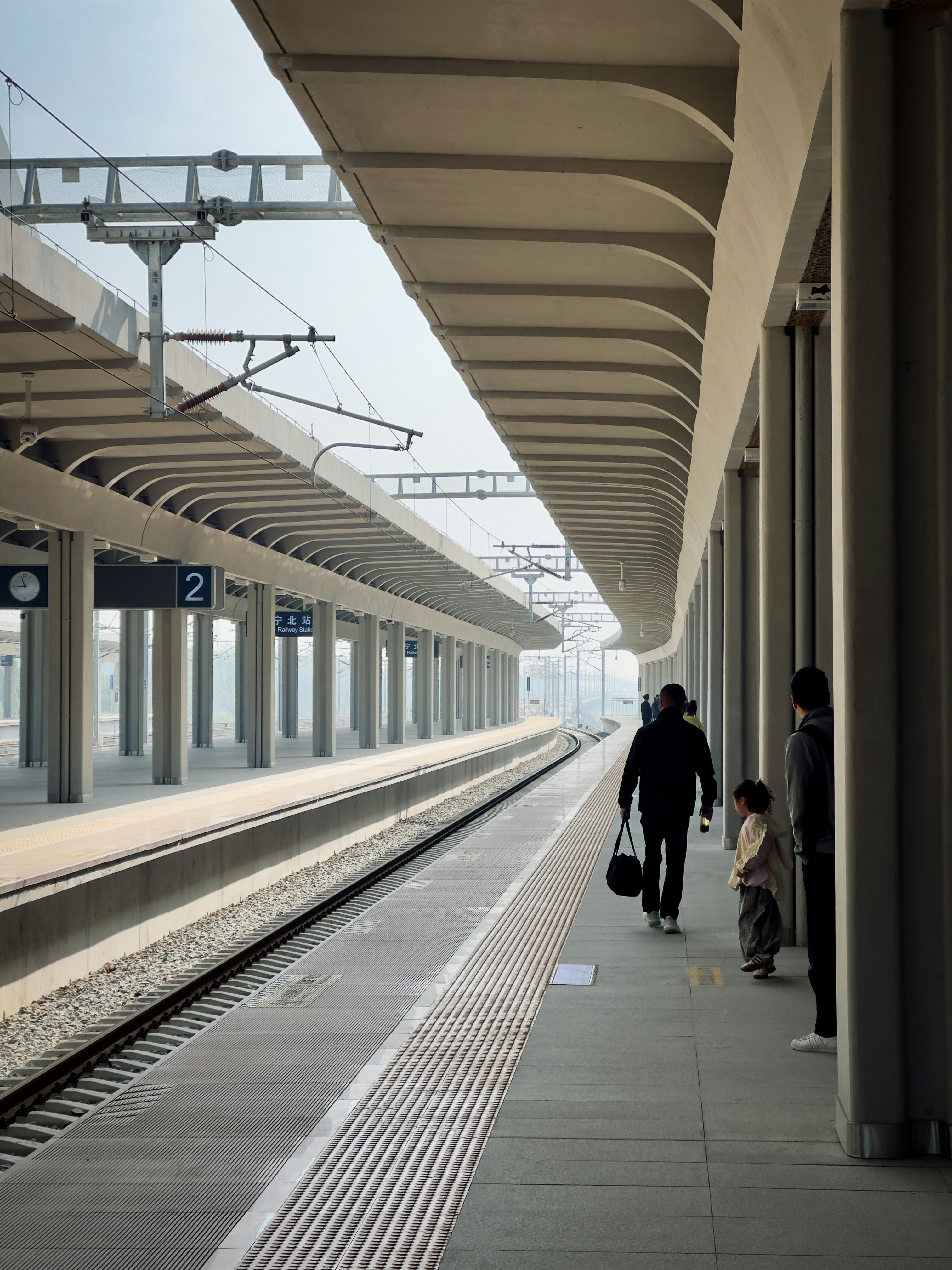 People waiting at a train station platform