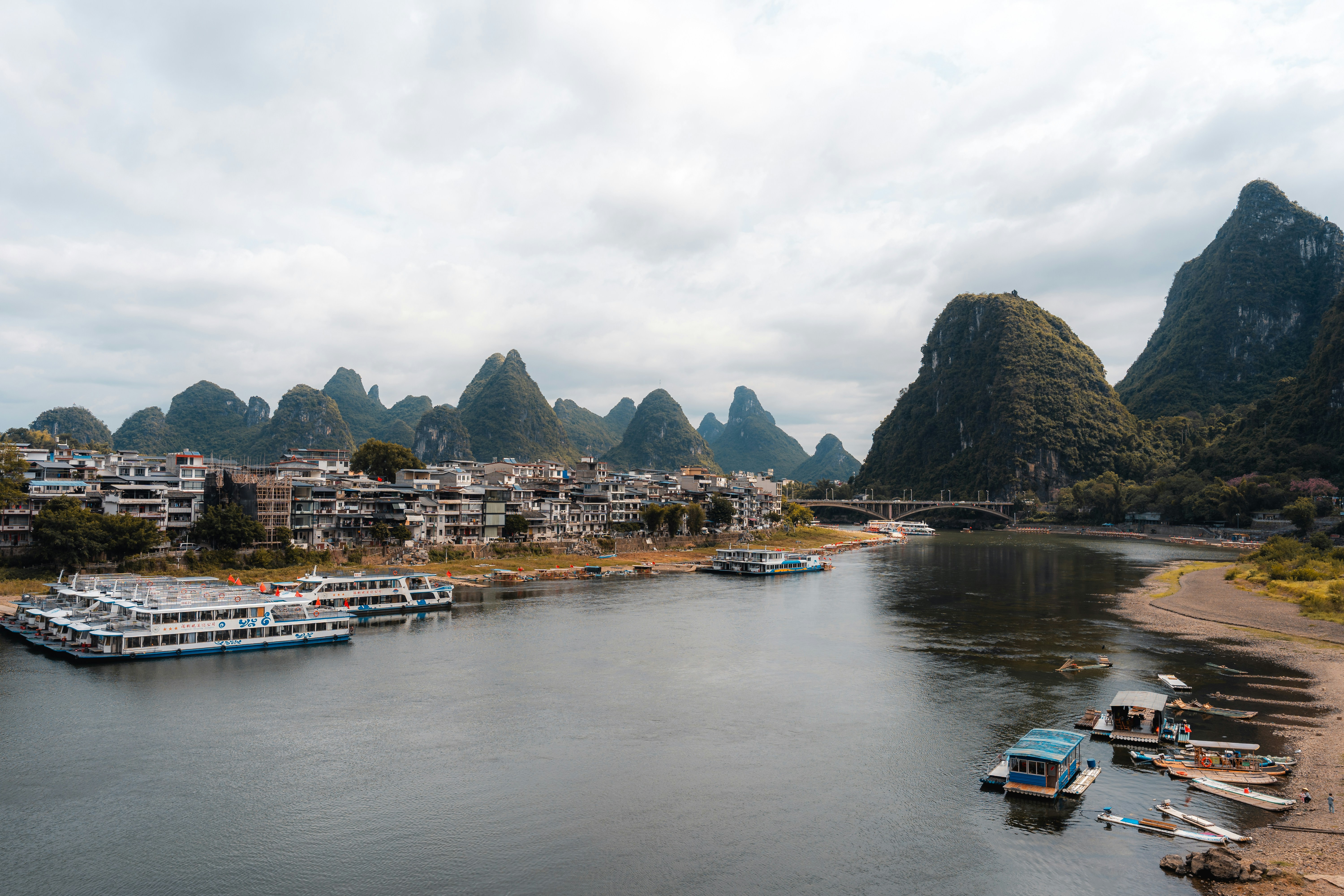 Boats on a river with karst mountains